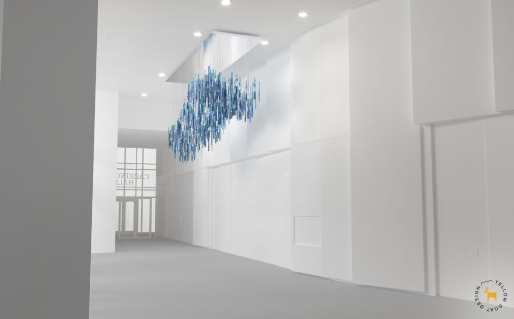 A modern, minimal white interior features a sculptural blue hanging installation made of multiple suspended rods, with natural light coming through tall windows in the background.